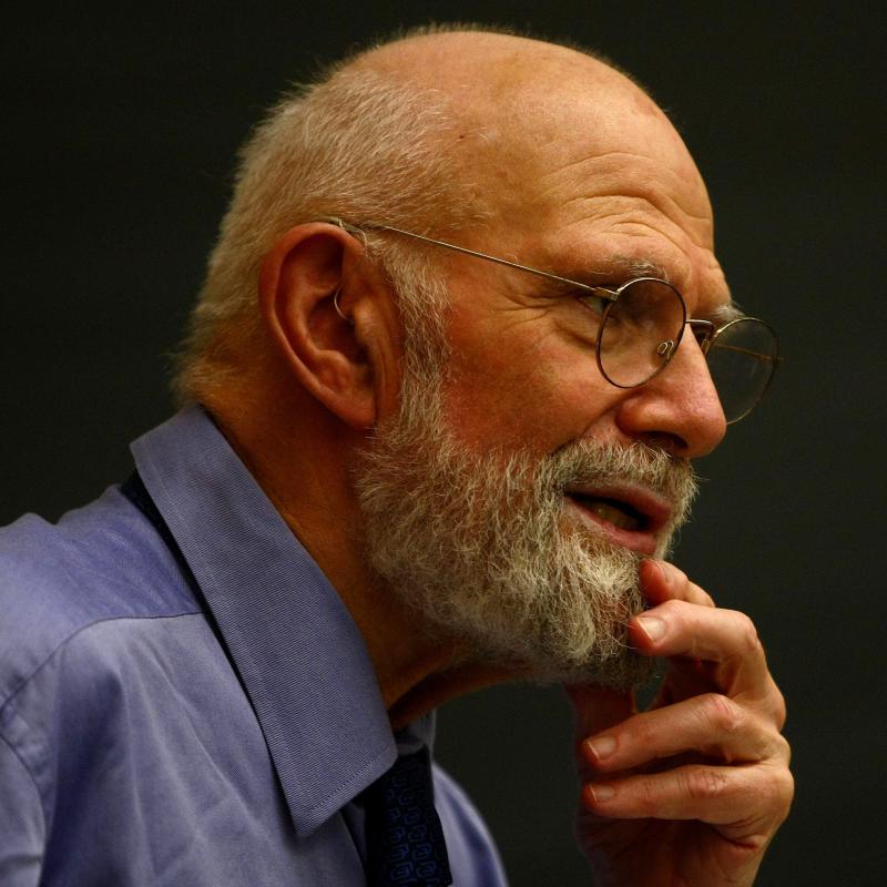 Oliver Sacks stroking his chin during a lecture