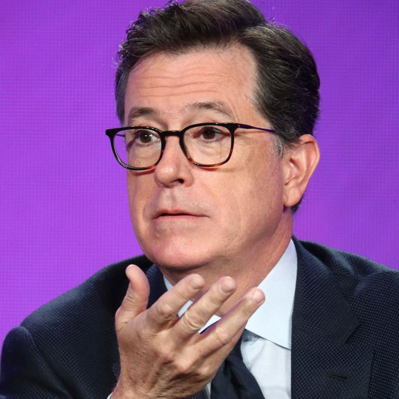 Comedian and Late Night host Stephen Colbert speaking and gesturing