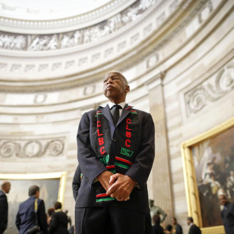 Former congressman and civil rights icon John Lewis stands in the Capitol.