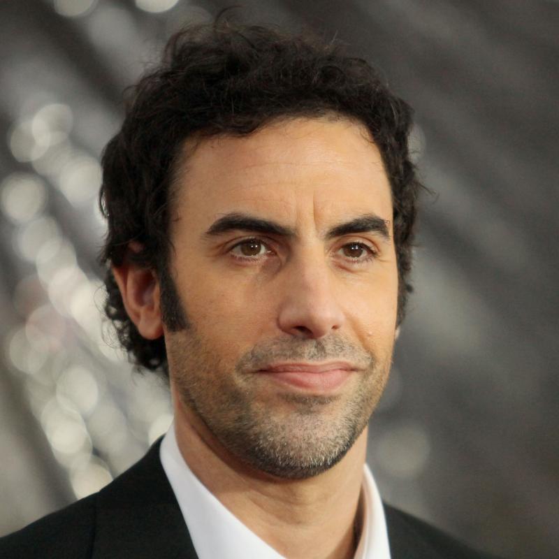 Actor Sacha Baron Cohen looks past the camera while appearing at an event