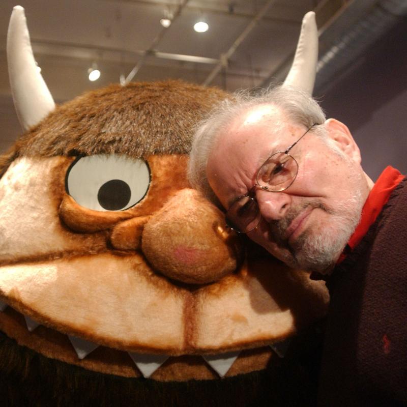 Children's book author Maurice Sendak poses with one of the creatures he created for his timeless book 'Where the Wild Things Are'
