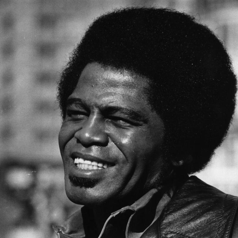 Legendary musician James Brown smiles in this 1971 black and white photo