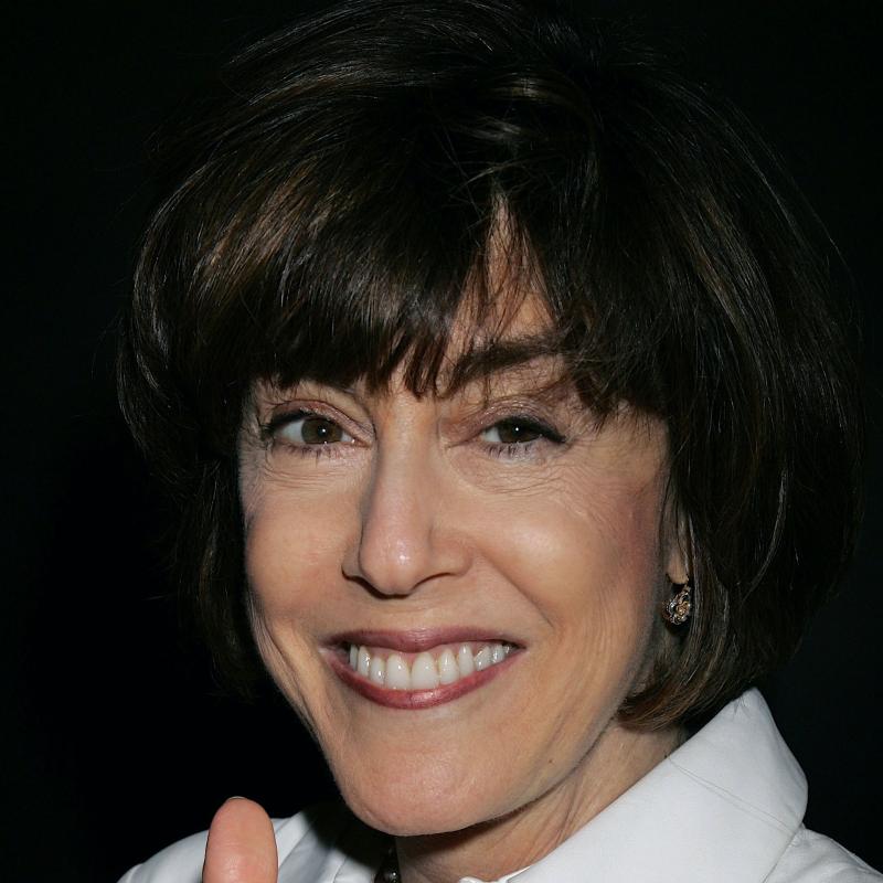 Journalist and filmmaker Nora Ephron smiles at the camera